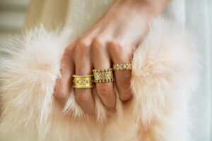 picture of a woman hand wearing fine gold rings