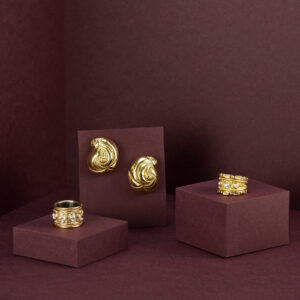 a picture of 4 gold rings and earrings