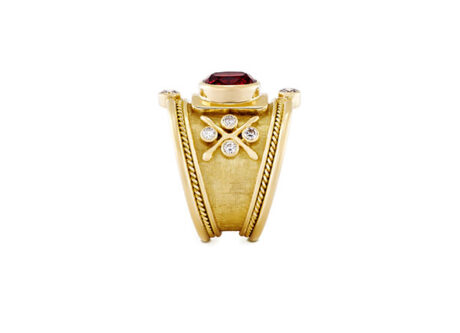 18ct yellow gold Templar ring with a 1.95ct red spinel, diamond accents, gold bead detailing, and a linen-textured background.
