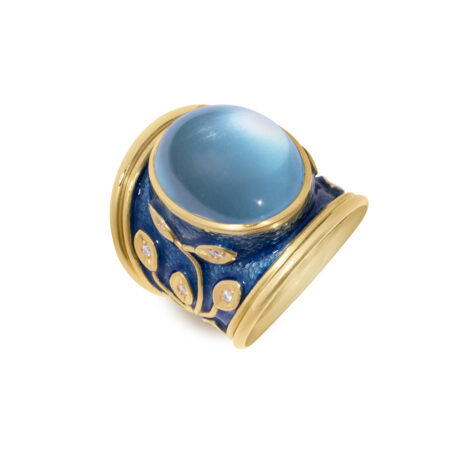 18ct yellow gold Templar ring with a 16.02ct oval aquamarine cabochon, diamond-set leaf motifs, mid-blue enamel background, and double wire edges.