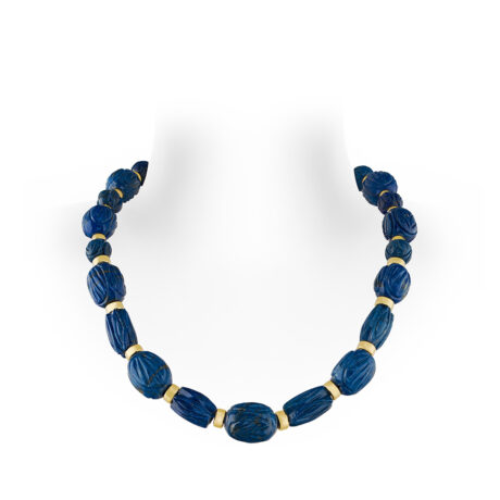 18ct yellow gold necklace with carved lapis lazuli beads, 22 gold rondells, and a polished gold funnel clasp. 19 inches in length.
