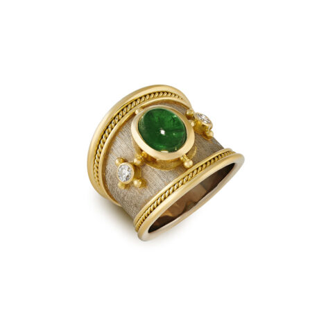 18ct yellow and white gold Templar ring with a 2.22ct cabochon emerald, two diamonds, gold bead detailing, wire-twist-wire edge, and linen-textured background.
