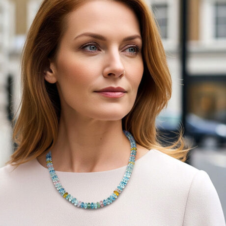 Shop this 21-inch faceted multi-coloured beryl necklace with a graduated design and a detailed dragon head clasp. Elegant, colourful, and unique.