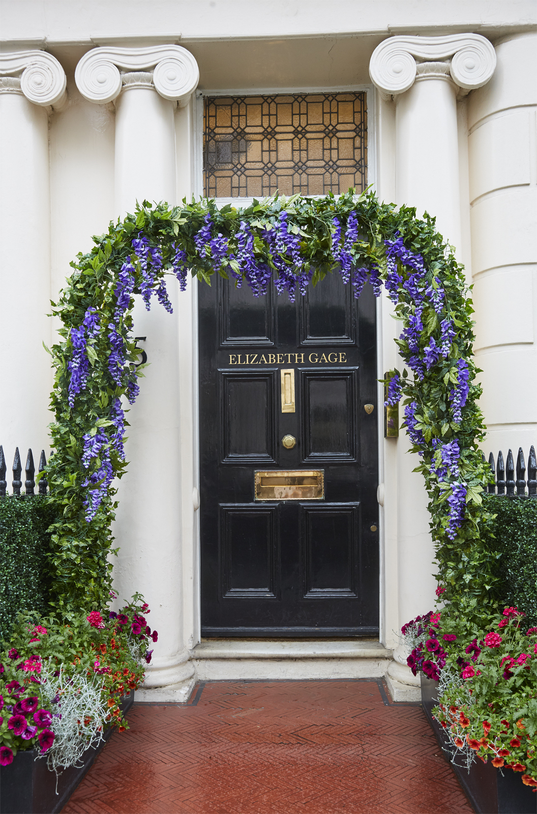 Elizabeth Gage exterior entrance with floral arch