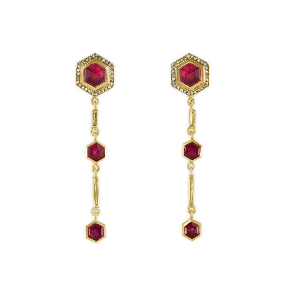 18ct yellow gold drop earrings set with hexagonal faceted rubies and pavé-set diamond detail with carved gold block accents.